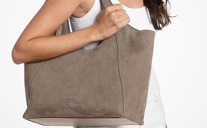 A Woman Wearing Michael Kors Bernie Large Tote Bag