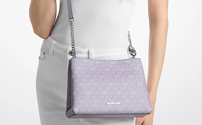 A Woman Wearing Michael Kors Christina Small Signature Logo Crossbody Bag A Woman Wearing Michael Kors Christina Small Signature Logo Crossbody Bag