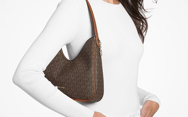 A Woman Wearing Michael Kors Nayla Small Signature Logo Hobo Shoulder Bag A Woman Wearing Michael Kors Nayla Small Signature Logo Hobo Shoulder Bag