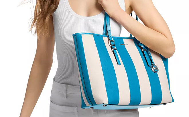 A Woman Wearing Michael Kors Quinn Large East West Tote Handbag A Woman Wearing Michael Kors Quinn Large East West Tote Handbag