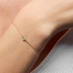 A Woman Wearing Zales Lab Grown Diamond Accent Bee Bracelet in 10K Gold