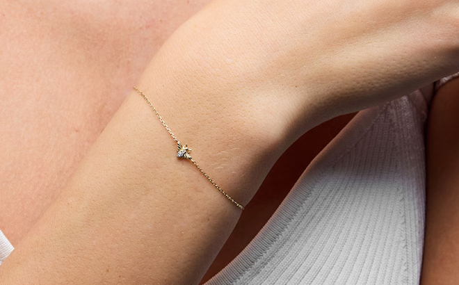 A Woman Wearing Zales Lab Grown Diamond Accent Bee Bracelet in 10K Gold