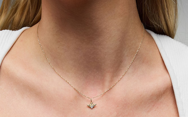 A Woman Wearing Zales Lab Grown Diamond Accent Bee Pendant in 10K Gold