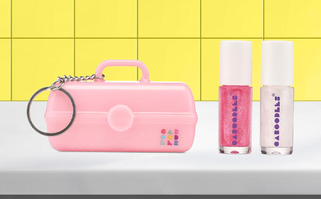 Caboodles Mini On The Go Girl Keychain with Lip Gloss on the Table