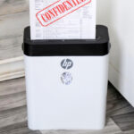 Confidential Document Being Shredded Using the HP 8 Sheet Crosscut Shredder