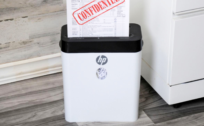 Confidential Document Being Shredded Using the HP 8 Sheet Crosscut Shredder Confidential Document Being Shredded Using the HP 8 Sheet Crosscut Shredder
