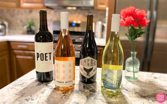 Four Bottles of Wine on a Kitchen Counter Four Bottles of Wine on a Kitchen Counter
