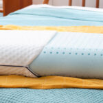 Linenspa Medium Feel Standard Size Ventilated Memory Foam Bed Pillow on the Bed