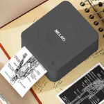 Nelko Portable Bluetooth Sticker Printer on the Notebook