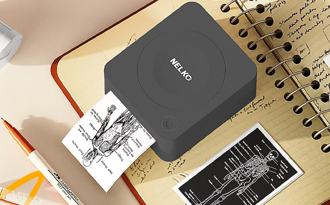 Nelko Portable Bluetooth Sticker Printer on the Notebook Nelko Portable Bluetooth Sticker Printer on the Notebook