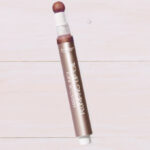 Tarte Maracuja Juicy Plumping Lip Oil on the Table
