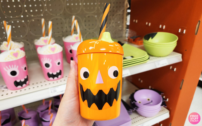 a Person Holding Pillowfort Pumpkin Figural Tumbler