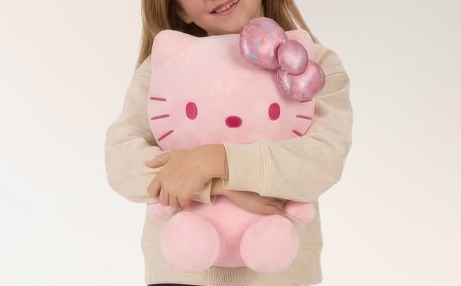 A Kid Holding Hello Kitty Kids Glow in the Dark Plush Cuddle Pillow Buddy A Kid Holding Hello Kitty Kids Glow in the Dark Plush Cuddle Pillow Buddy