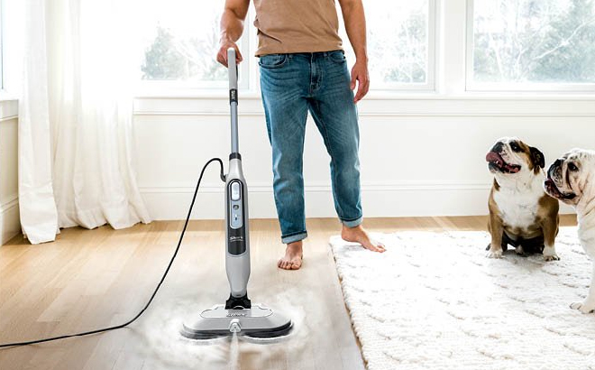 A Man Cleaning with Hardwood Floors with the Shark Steam Scrub Scrubbing Steam Mop A Man Cleaning with Hardwood Floors with the Shark Steam Scrub Scrubbing Steam Mop