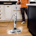 A Man Cleaning with the Shark Steam Scrub Scrubbing Steam Mop