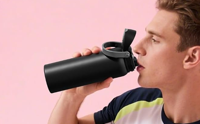 A Man Drinking from the Powcan 24 Ounce Insulated Water Bottle