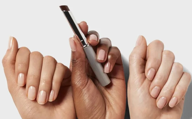 A Person Holding Clinique Black Honey Almost Lipstick A Person Holding Clinique Black Honey Almost Lipstick