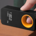 A Person Holding HOTO Pocket Size Laser Measuring Tool