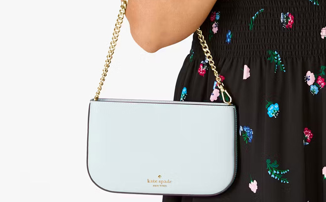 A Person Holding Kate Spade Madison Lilly Pochette