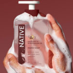 A Person Holding Native Liquid Hand Soap in Hazelnut Shortbread Crust