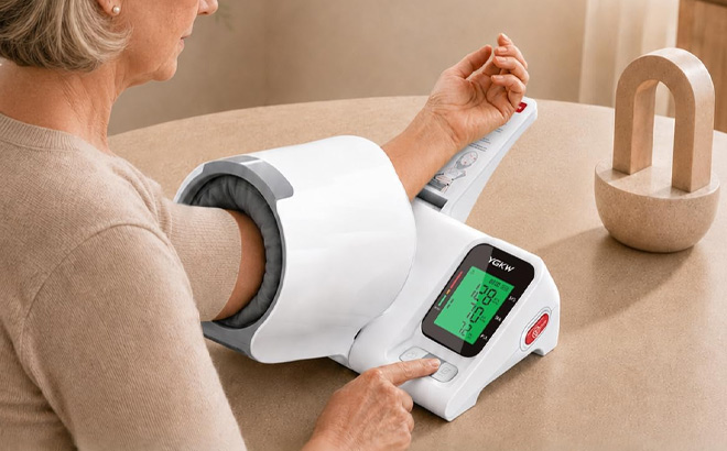 A Person Using Blood Pressure Monitor A Person Using Blood Pressure Monitor