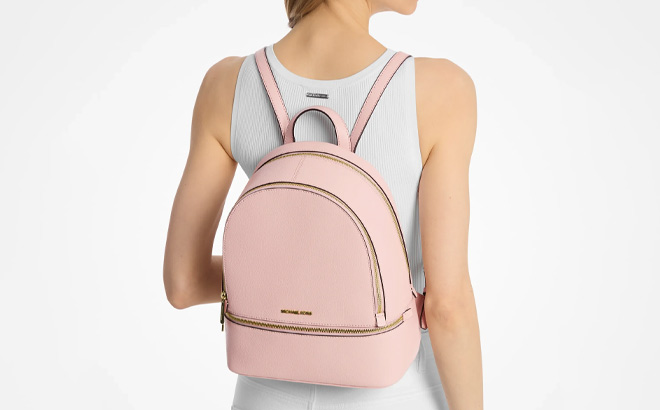 A Person Wearing Michael Kors Rhea Medium Pebbled Leather Backpack A Person Wearing Michael Kors Rhea Medium Pebbled Leather Backpack