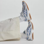 A Person Wearing New Balance Cool Skies 204L Shoes
