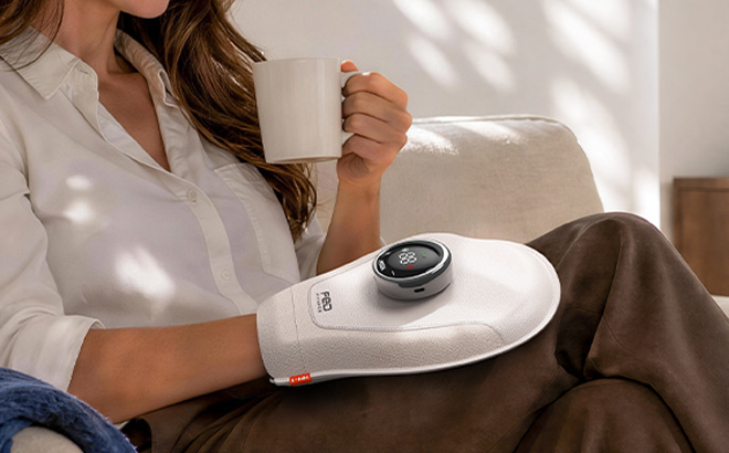 A Person Wearing Red Light Hand Massager A Person Wearing Red Light Hand Massager