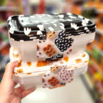 A Woman Holding Cook With Color 6 Piece Halloween Ghost and Pumpkin Rectangular Food Storage Container Set