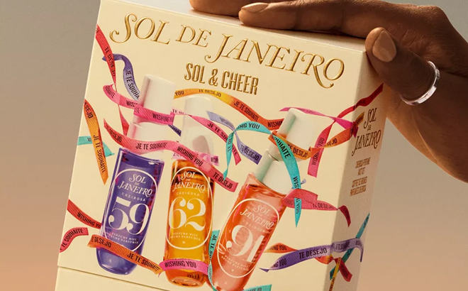 A Woman Holding Sol de Janeiro Sol Cheer Travel Perfume Gift Set A Woman Holding Sol de Janeiro Sol Cheer Travel Perfume Gift Set