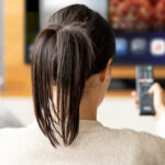 A Woman Streaming on TV