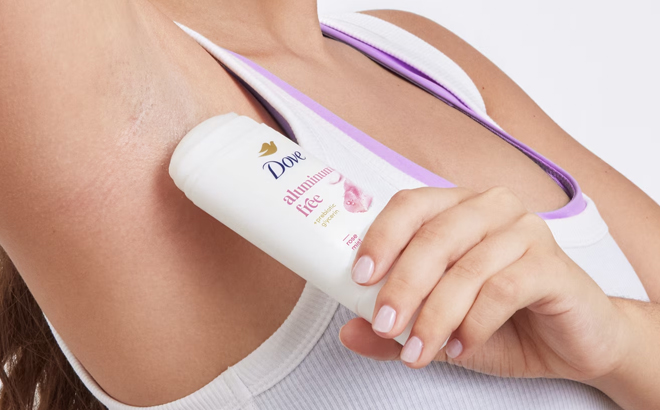 A Woman Using Dove Aluminum Free Deodorant Stick for 72 Hour Odor Protection in Rose Mist A Woman Using Dove Aluminum Free Deodorant Stick for 72 Hour Odor Protection in Rose Mist
