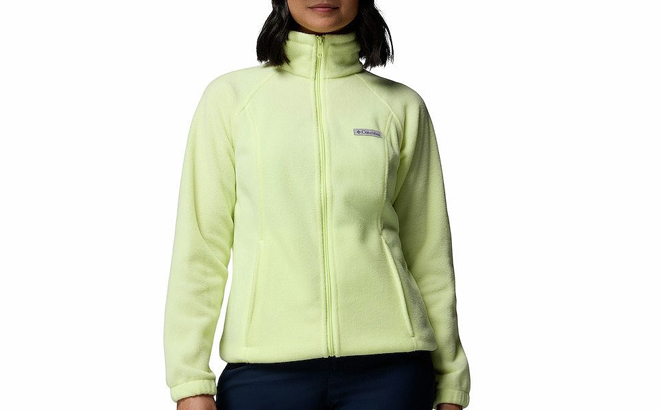 A Woman Wearing Columbia Benton Springs Zip Front Fleece Jacket in Citron Haze