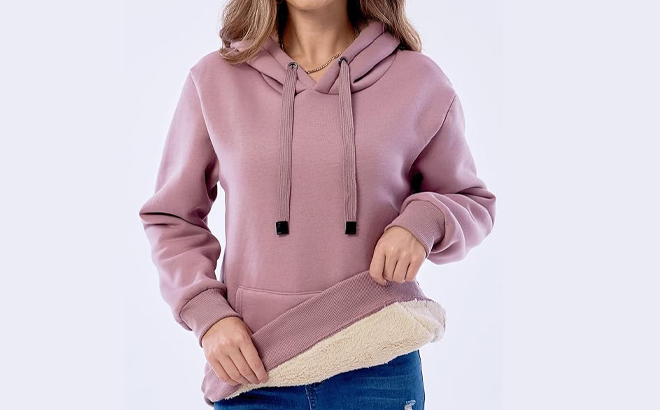 A Woman Wearing Haellun Fleece Sherpa Lined Pullover Hooded Sweatshirt