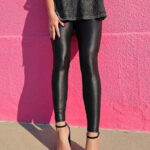 A Woman Wearing SANTINY Faux Leather Leggings