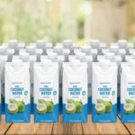 Amazon Grocery Pure Coconut Water 24 Count on the Table