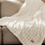 Bedsure Cloud Bubble Soft Cozy Throw Blanket on a Bed