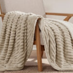 Bedsure Reversible Sherpa Fleece Blanket on a Chair