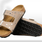 Birkenstock Arizona Rivets Studded Kids Slide Sandals on the Table