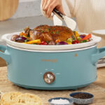 Crock Pot Manual 7 Quart Slow Cooker on the Table