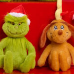 Grinch Plushies on the Red Table