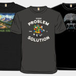 Three Woots Graphic Tees on Gray Background