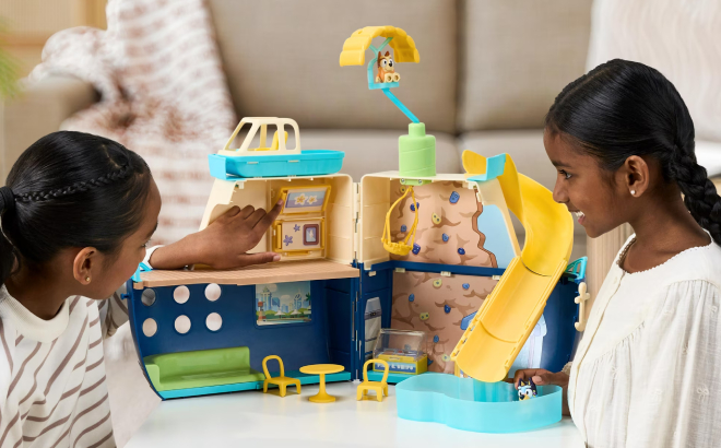 Two Girls Playing with Bluey Cruise Ship Playset