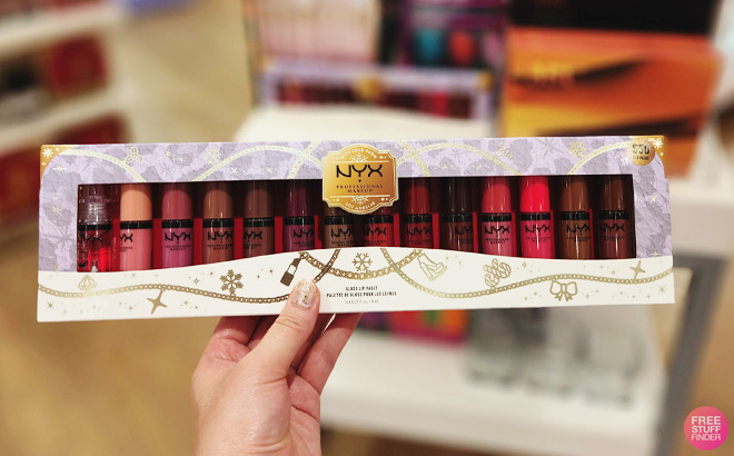 A Hand Holding the NYX Holiday Butter Lip Gloss Kit