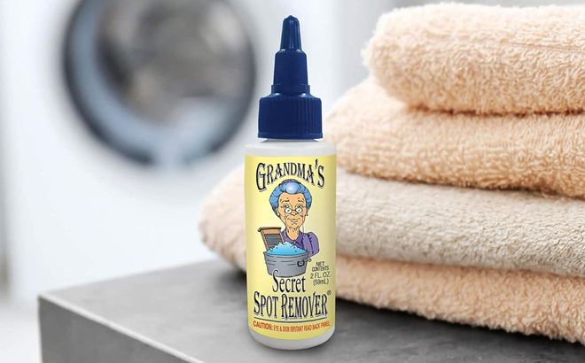 Grandmas Secret Spot Remover with Towels and Washing Machine in the Back